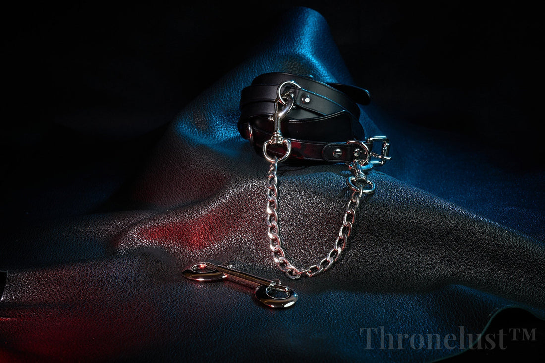Elegant BDSM ritual gear – leather cuffs and chain for bondage play by Thronelust™
