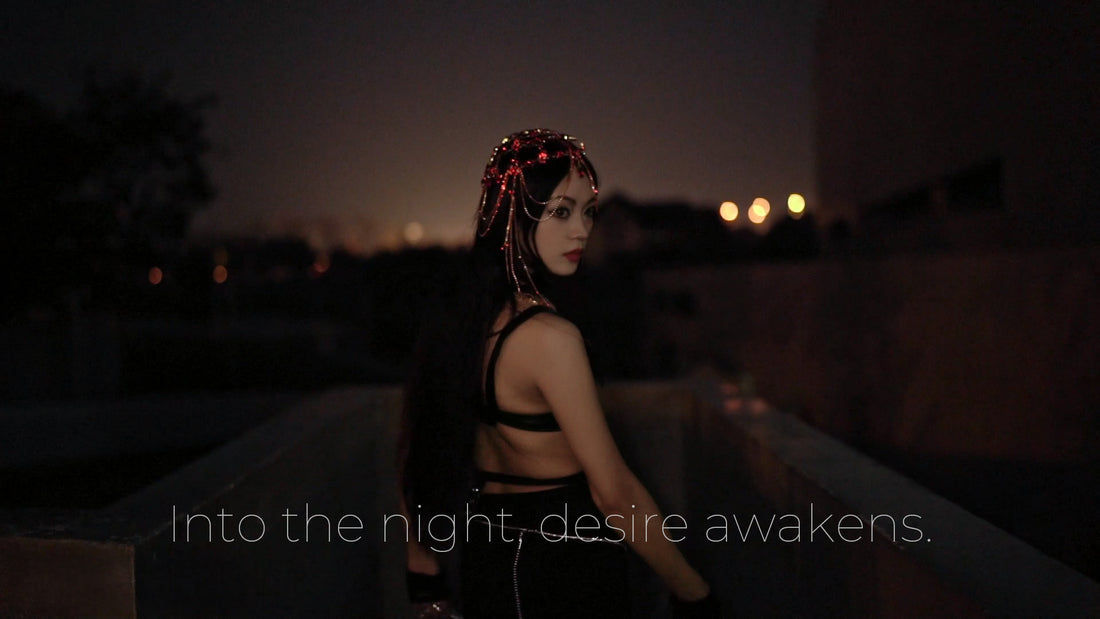 A woman in dark BDSM-inspired attire turning back under night lights. Thronelust brand intro video.