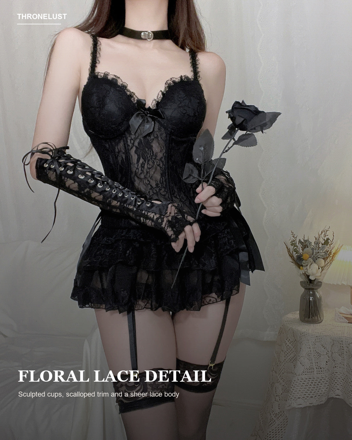 Close-up of the sheer black floral lace and sculpted cups on the Noir Court corset dress.
